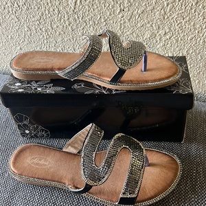 New! Shine with glamour on this cubic zirconia sandals.